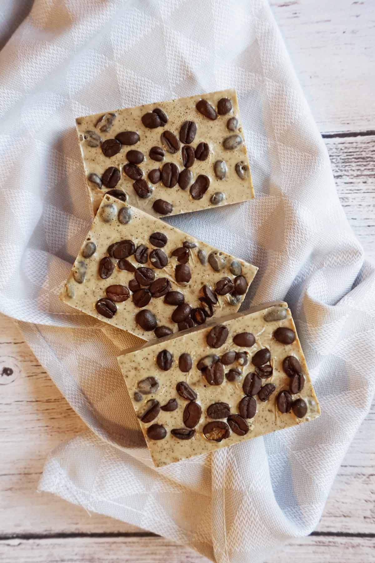 coffee oatmeal soap bars on a towel.