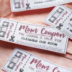 mom coupons scattered on a pink cloth.