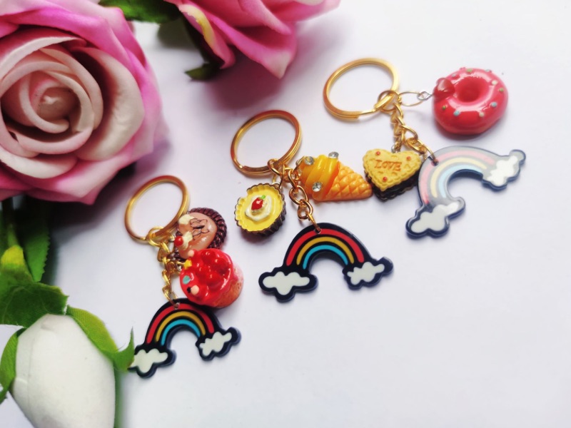 Three handmade keychains on a table.